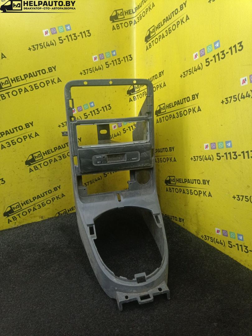 консоль салона Mazda 121 2 поколение 1995, 1.3 л., бензин, МКПП, синий, седан - фото №1