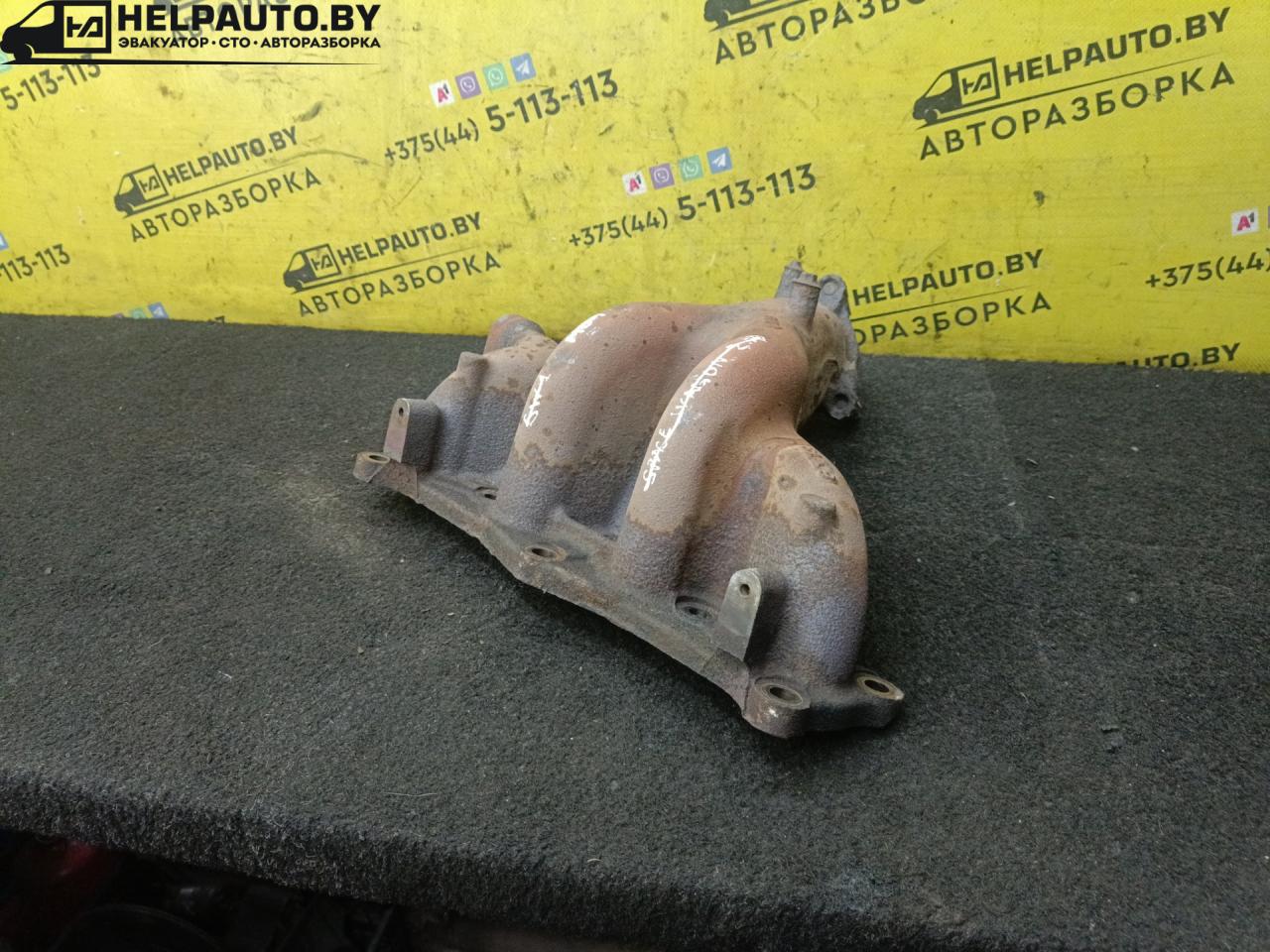 коллектор выпускной Mazda 323 5 поколение 1997, 1.5 л., бензин, МКПП, зелый, хетчбэк 5 дв., передний привод - фото №1