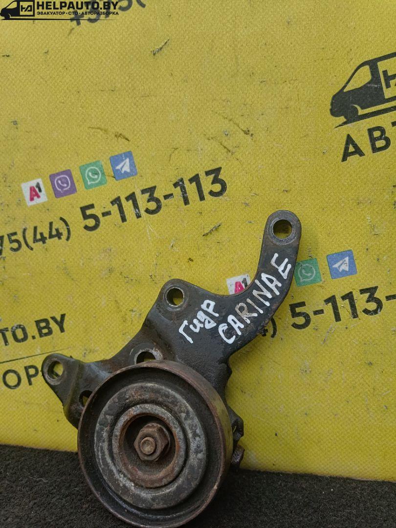 натяжитель Toyota Carina E 1 поколение 1995, 2.0 л., 2C, дизель, МКПП, бордовый, хетчбэк 5 дв., передний привод - фото №1