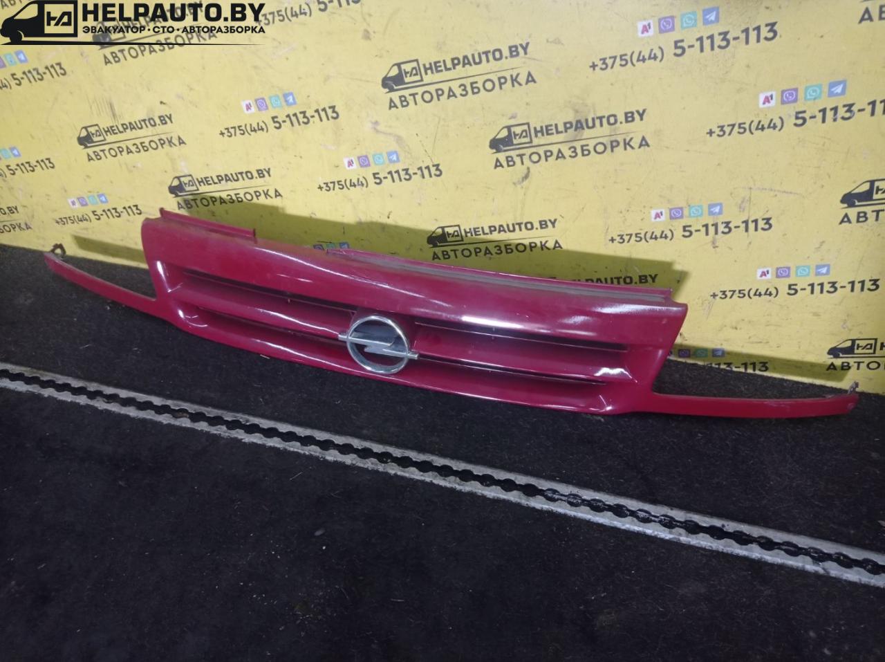 решетка радиатора Opel Astra F 1992, 1.4 л., C 14 NZ, бензин, МКПП, красный, хетчбэк 5 дв., передний привод - фото №1